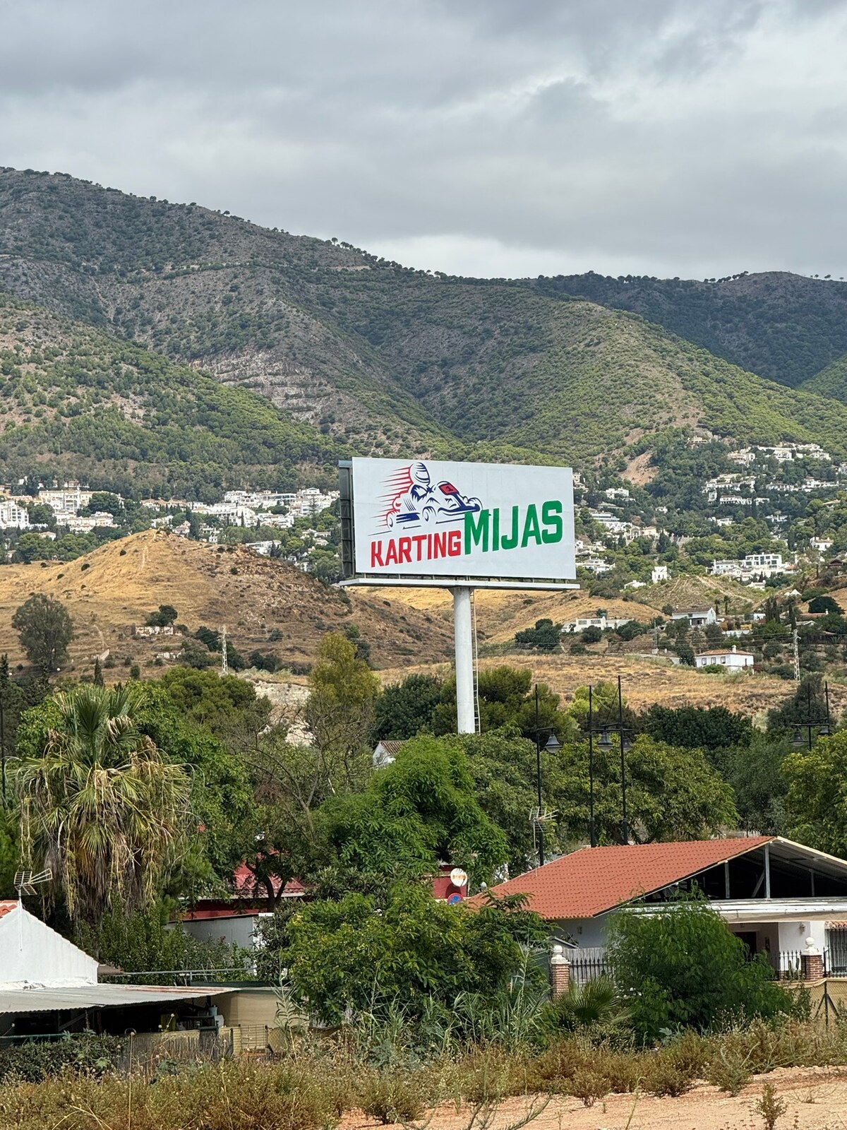 Large Karting Mijas billboard dominating the mountain landscape
