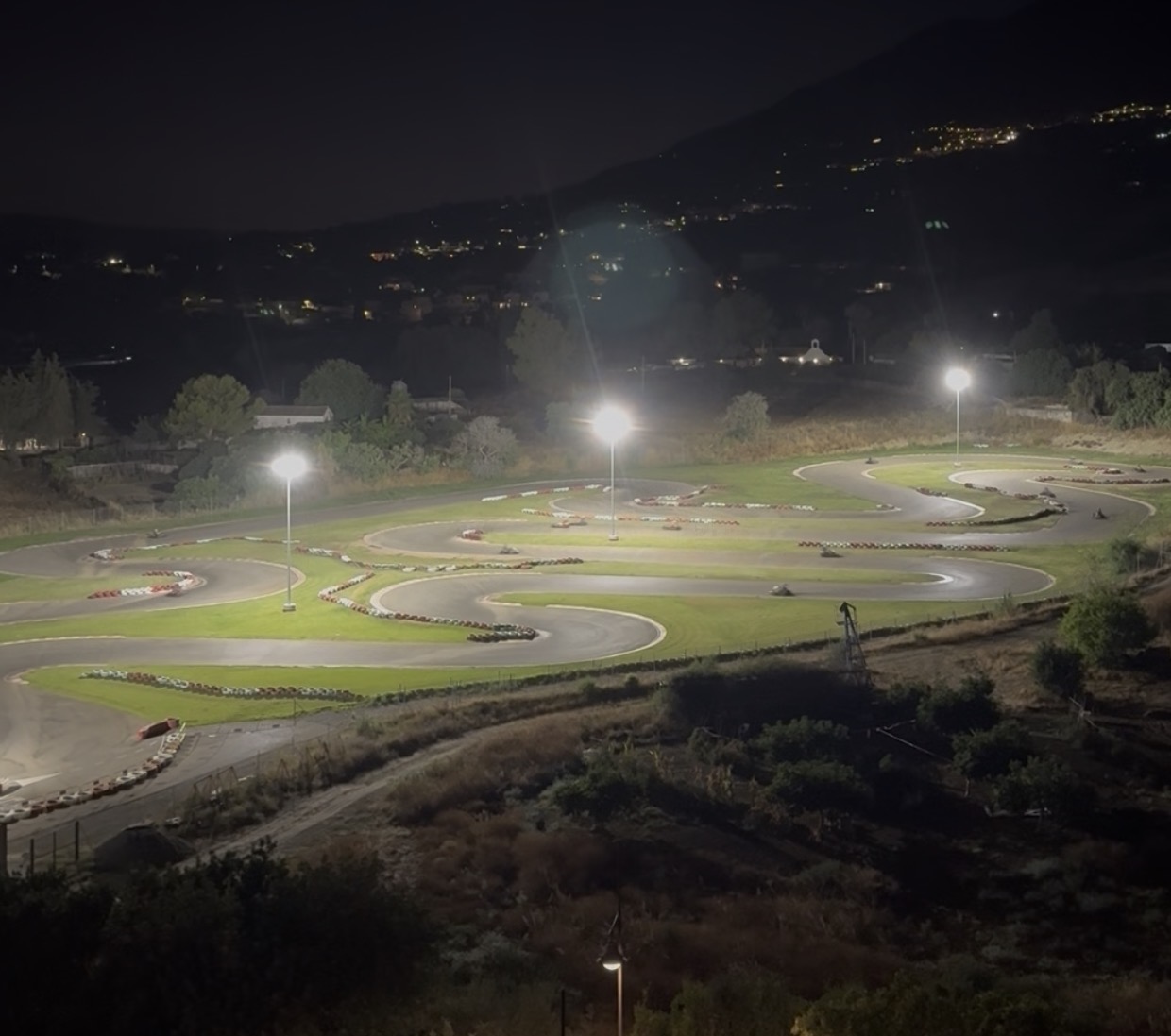 Night view of Mijas Karting floodlights from a nearby residential property